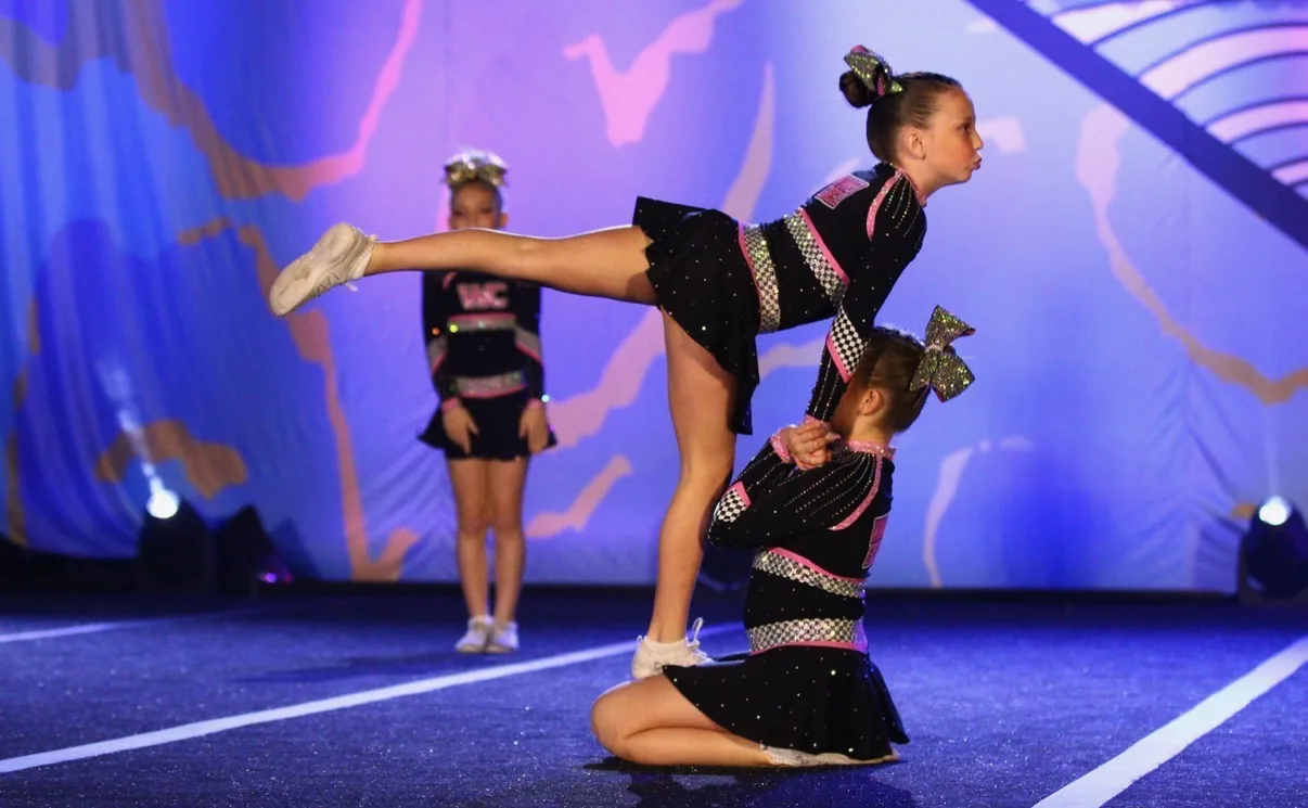 Winner Circle Athletics cheerleaders performing a stunt at competition
