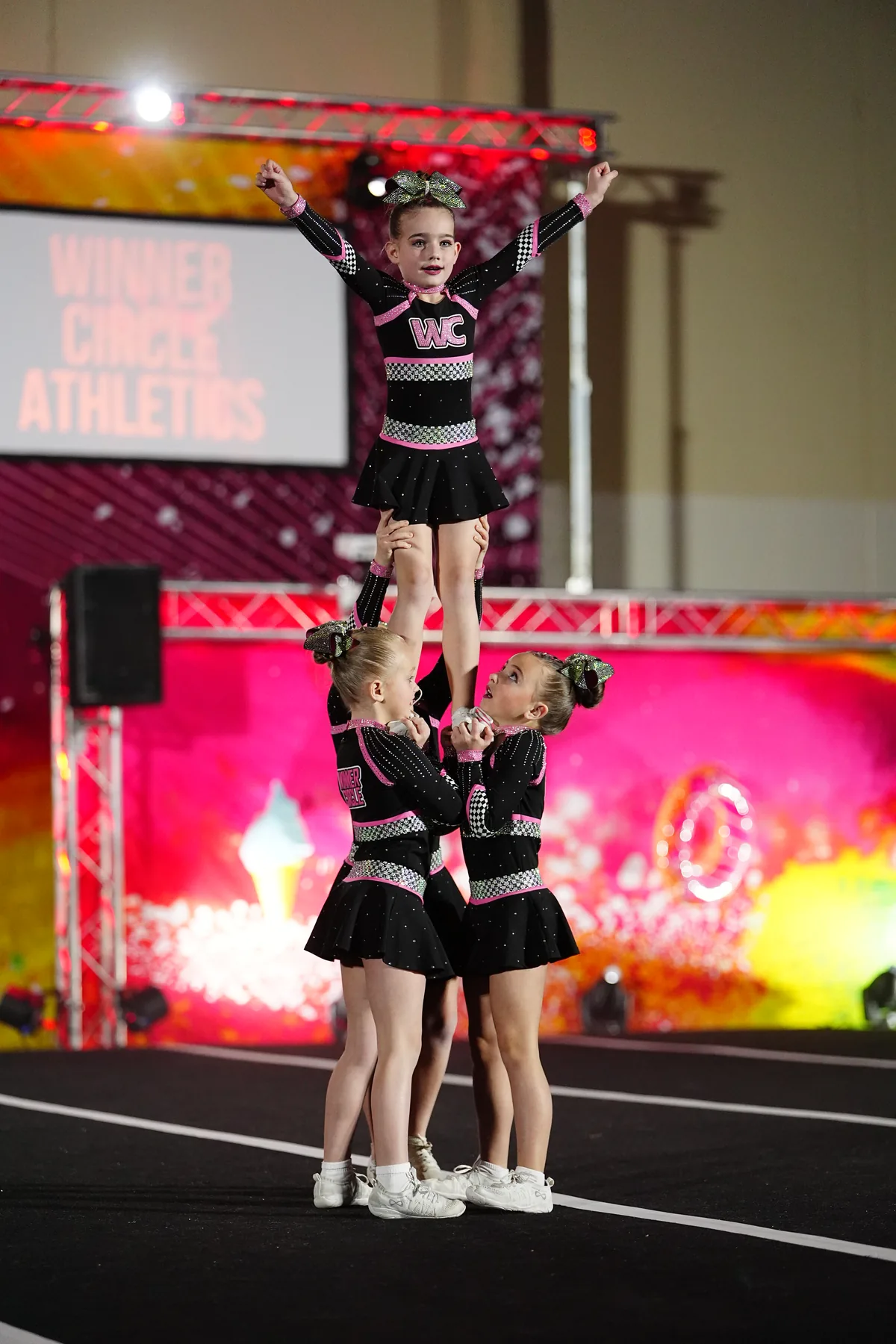 Winner Circle Athletics cheerleaders performing on stage